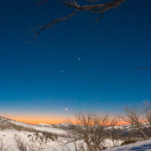 Planets Align Over Snowy Mountains