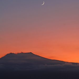 Moon and Jupiter above Mount Etna