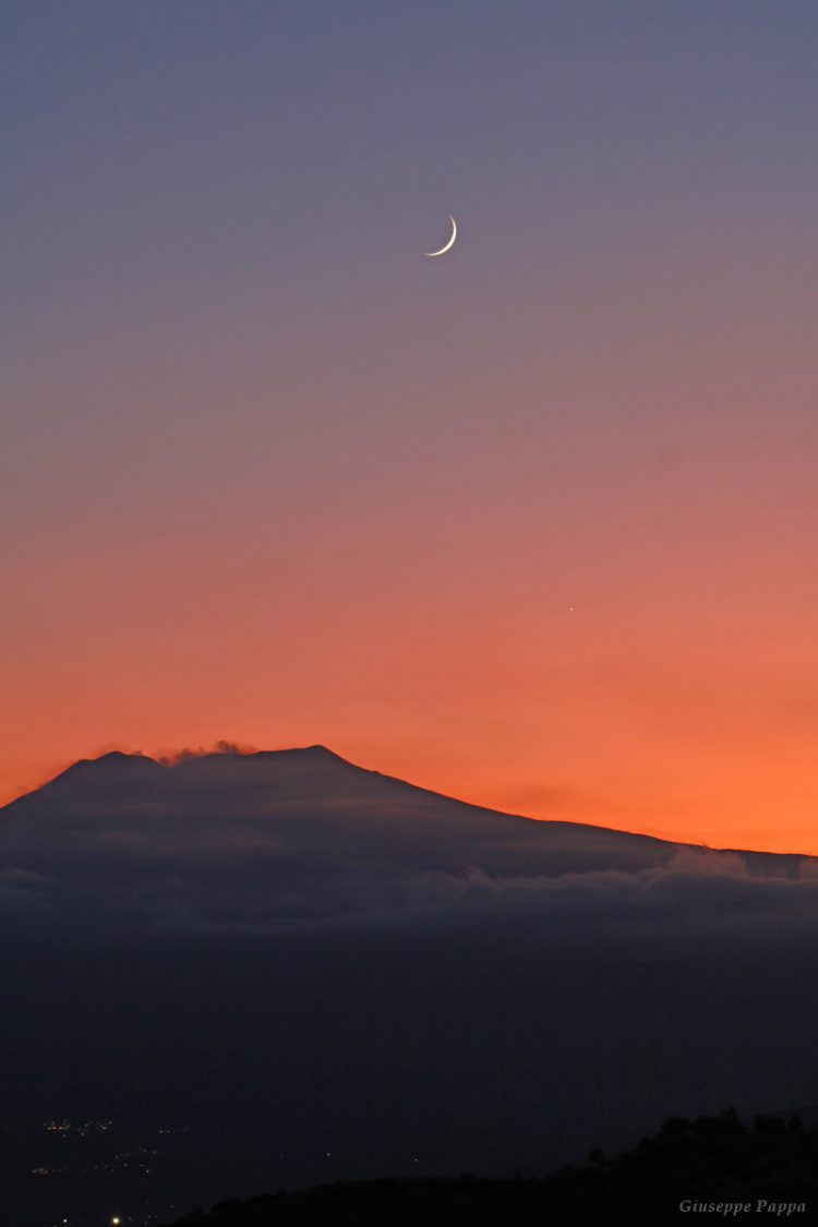 Moon and Jupiter above Mount Etna