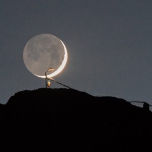 Moonset Behind Tibetan Prayer Flags