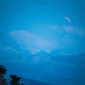 Eclipsed Moon Rising Over the Alps