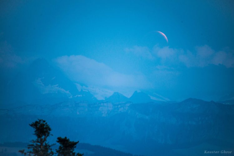 Eclipsed Moon Rising Over the Alps