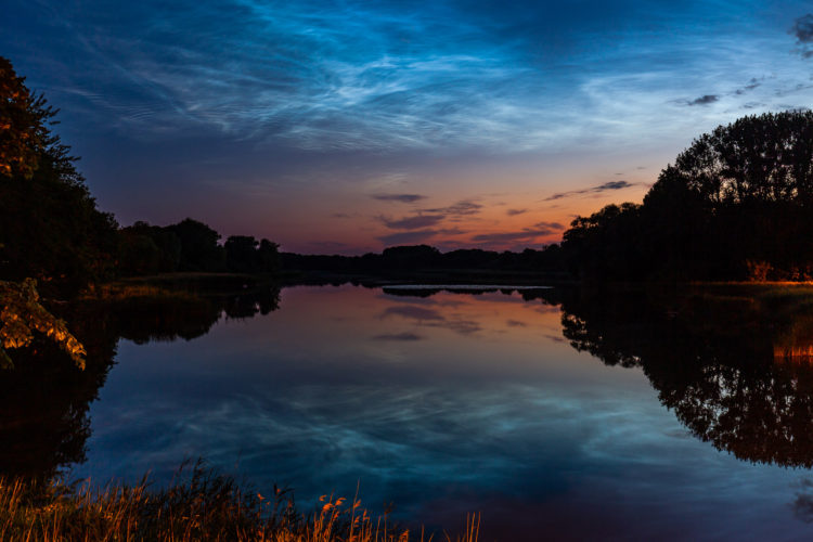 Mirrored Noctilucent Clouds