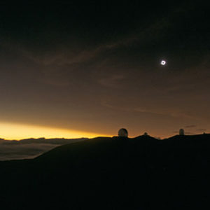 Eclipse of the Sun Above Mauna Kea