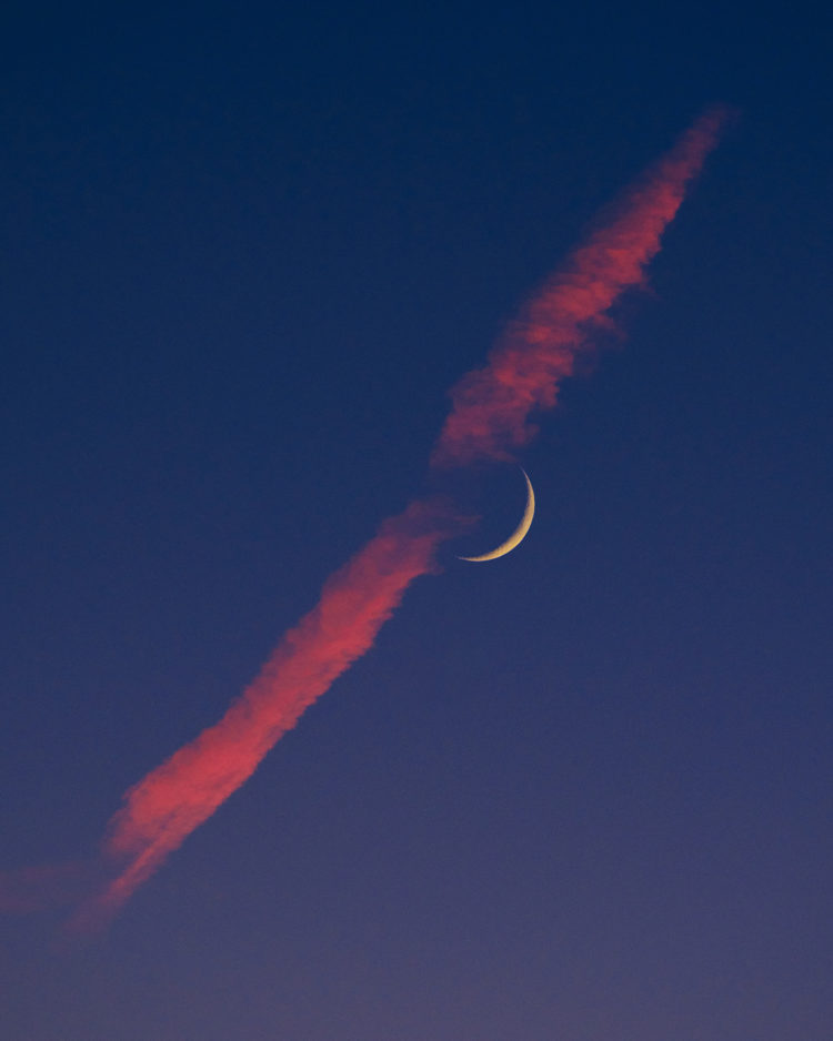 Moon and Red Contrail