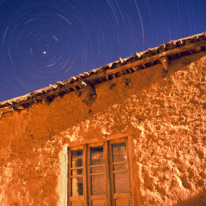 Night Passes Above a Village House