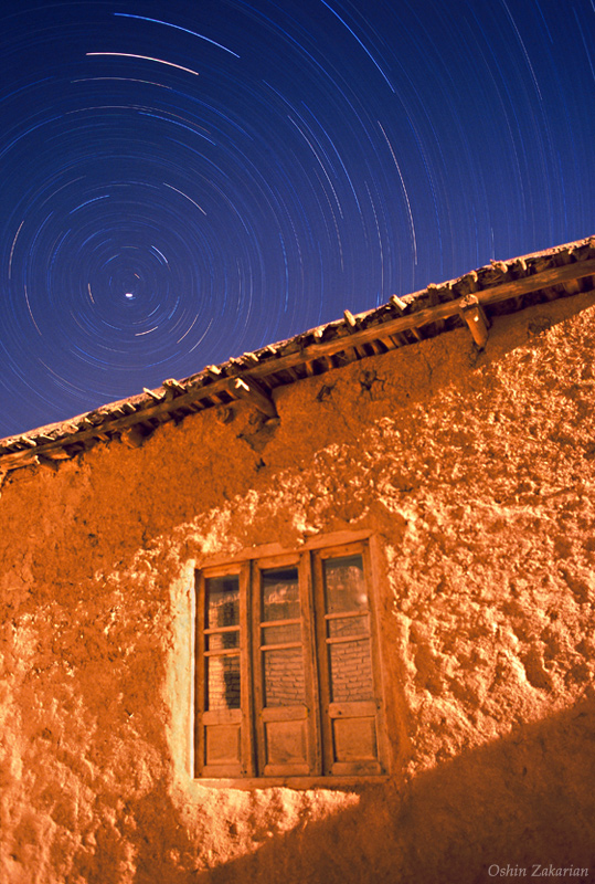 Night Passes Above a Village House