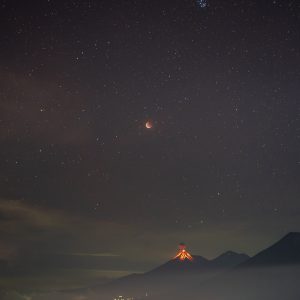 Eclipsed Moon, Pleiades and the Fuego Volcano