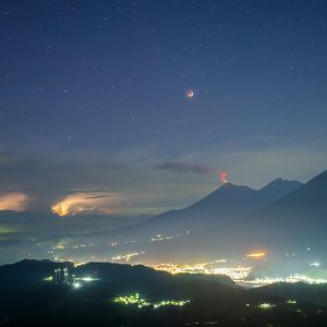 Eclipsed Moon, Pleiades and the Fuego Volcano