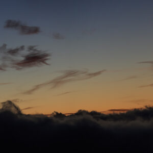 The Moon and the Comet Over a Cloudy Sea